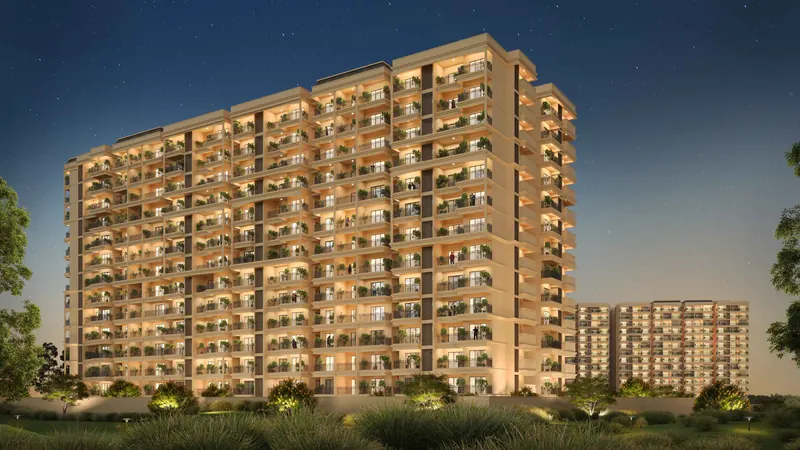 Nava Vruksha apartment tower lit at dusk