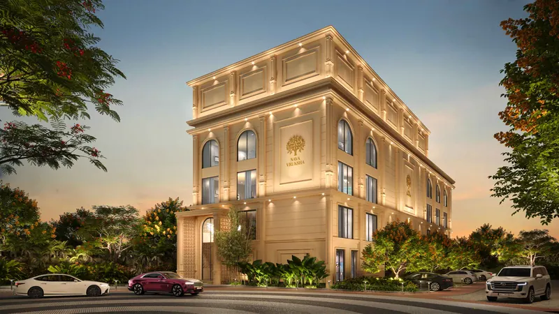 Nava Vruksha clubhouse building exterior at dusk