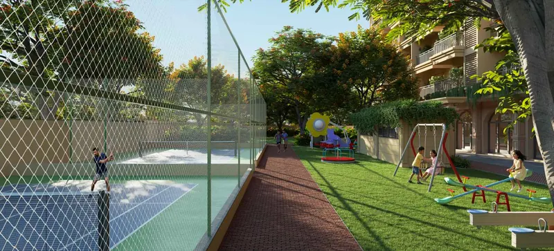 Fenced sports courts and play lawn at Nava Vruksha