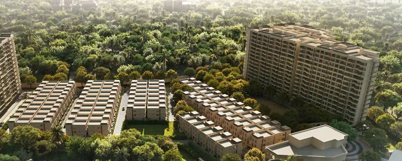 Aerial view of the Nava Vruksha villa enclave between the apartment towers